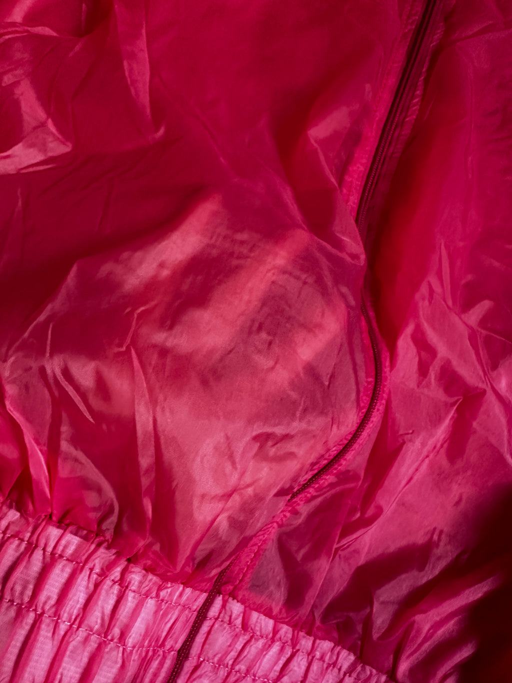 Corta vento rosa transparente