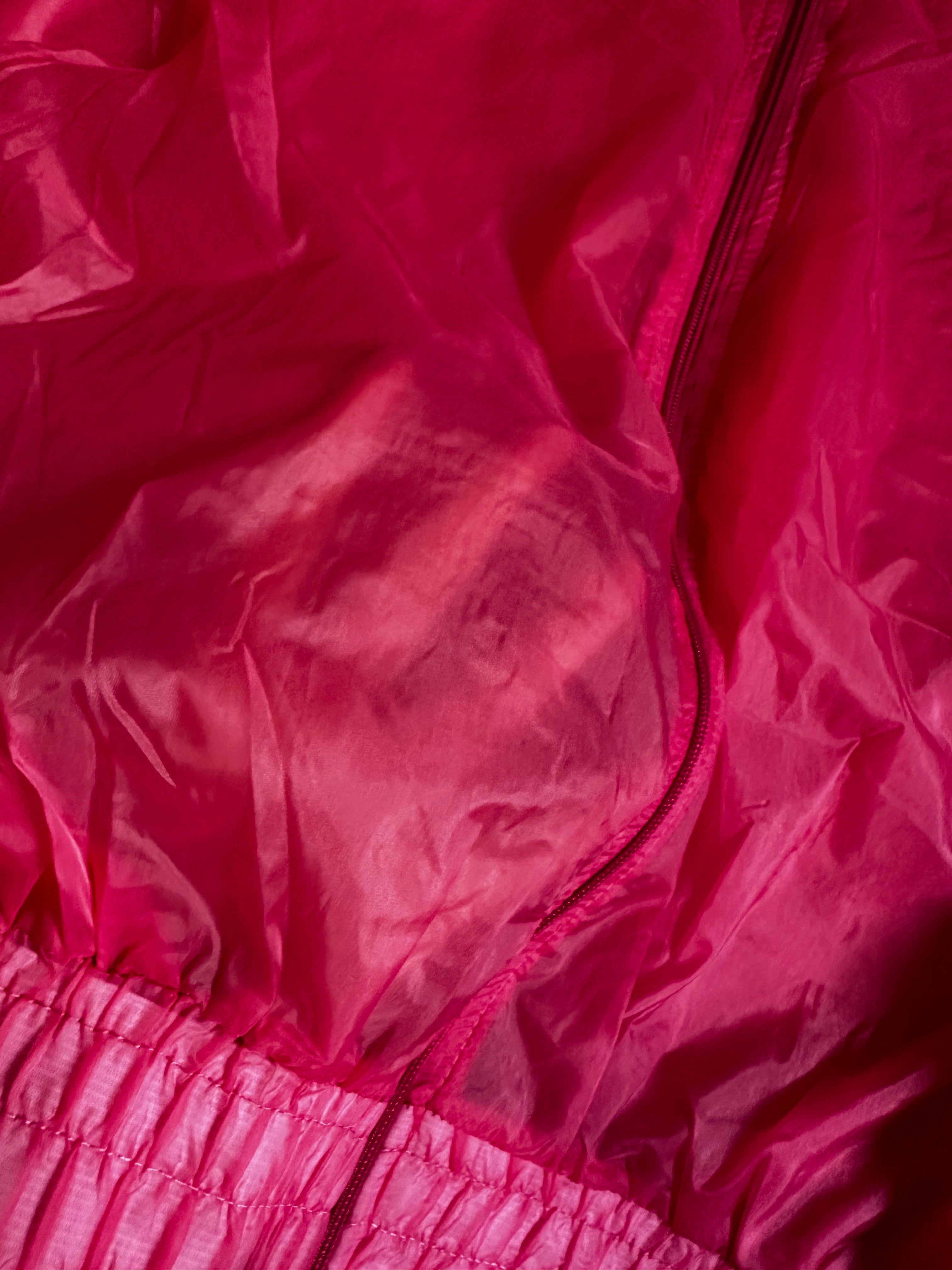 Corta vento rosa transparente